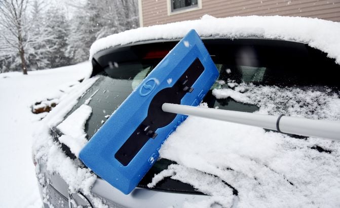snow joe snow broom clearing a Mazda CX-5 windshield