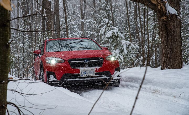 2020 Subaru Crosstrek cresting snowy hill