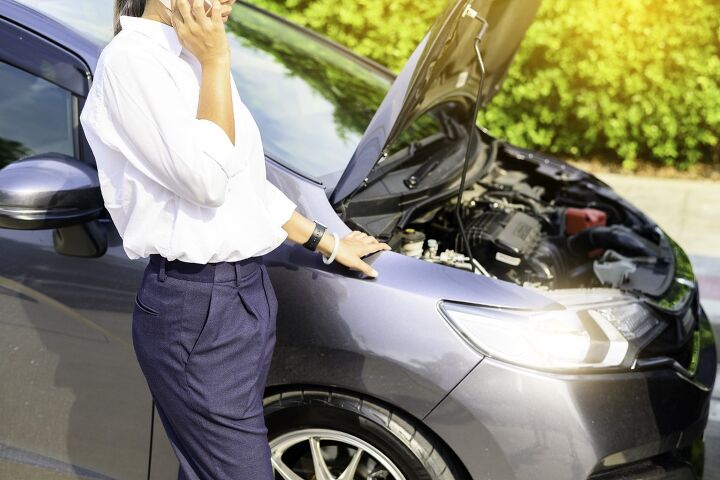 A person waits for assistance from one of the most reputable extended car warranty companies after a mechanical breakdown.