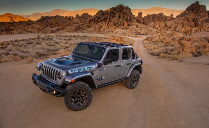 2021 Jeep Wrangler 4xe static wide angle front three-quarter in the desert