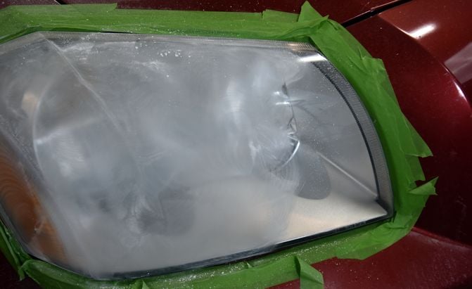 a headlight during the sanding process