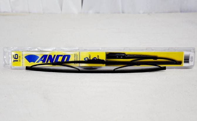 Anco windshield wiper blade sitting on a table