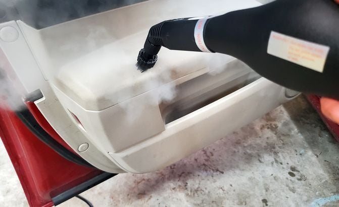 Steam cleaning a car interio