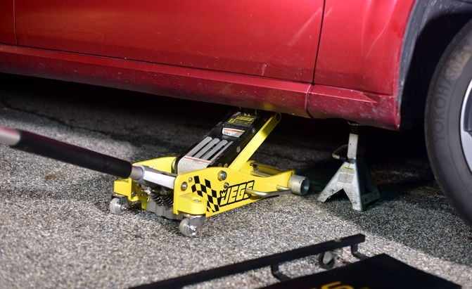 Lifting a Dodge Magnum with a yellow Jegs floor jack