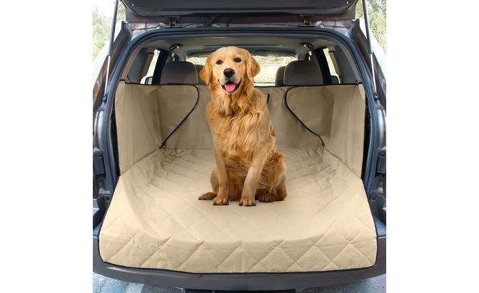 Golden retriever in the back of an SUV with cargo area cover