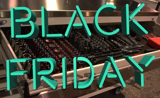 neon black friday text over a toolbox full of sockets