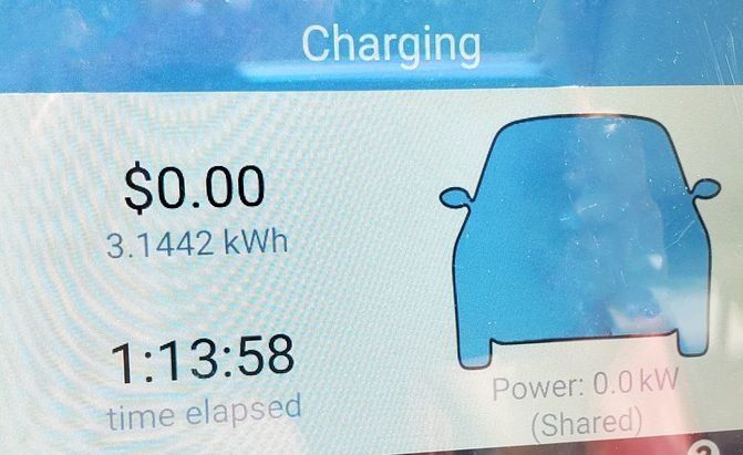 EV charging station display showing zero dollars and 3.14 kilowatt-hours
